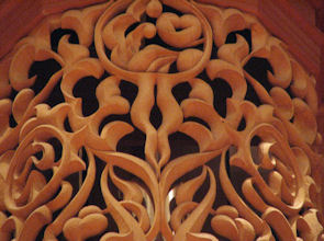 Carved wood dream catchers and looking glass in pipe shade carvings for Fritts pipe organ at Pacific Lutheran University, Tacoma WA